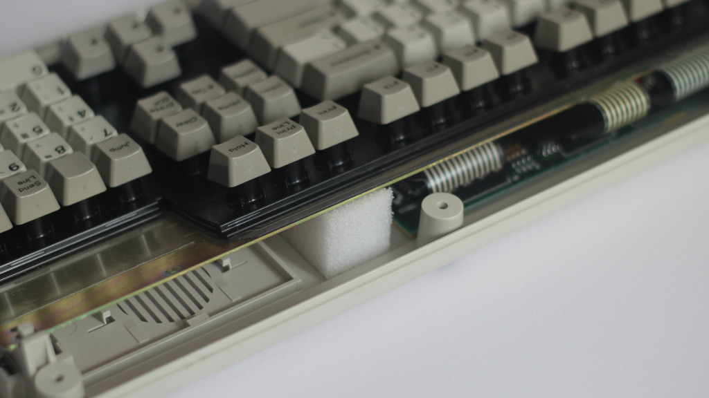 keyboard assembly resting on piece of polyester