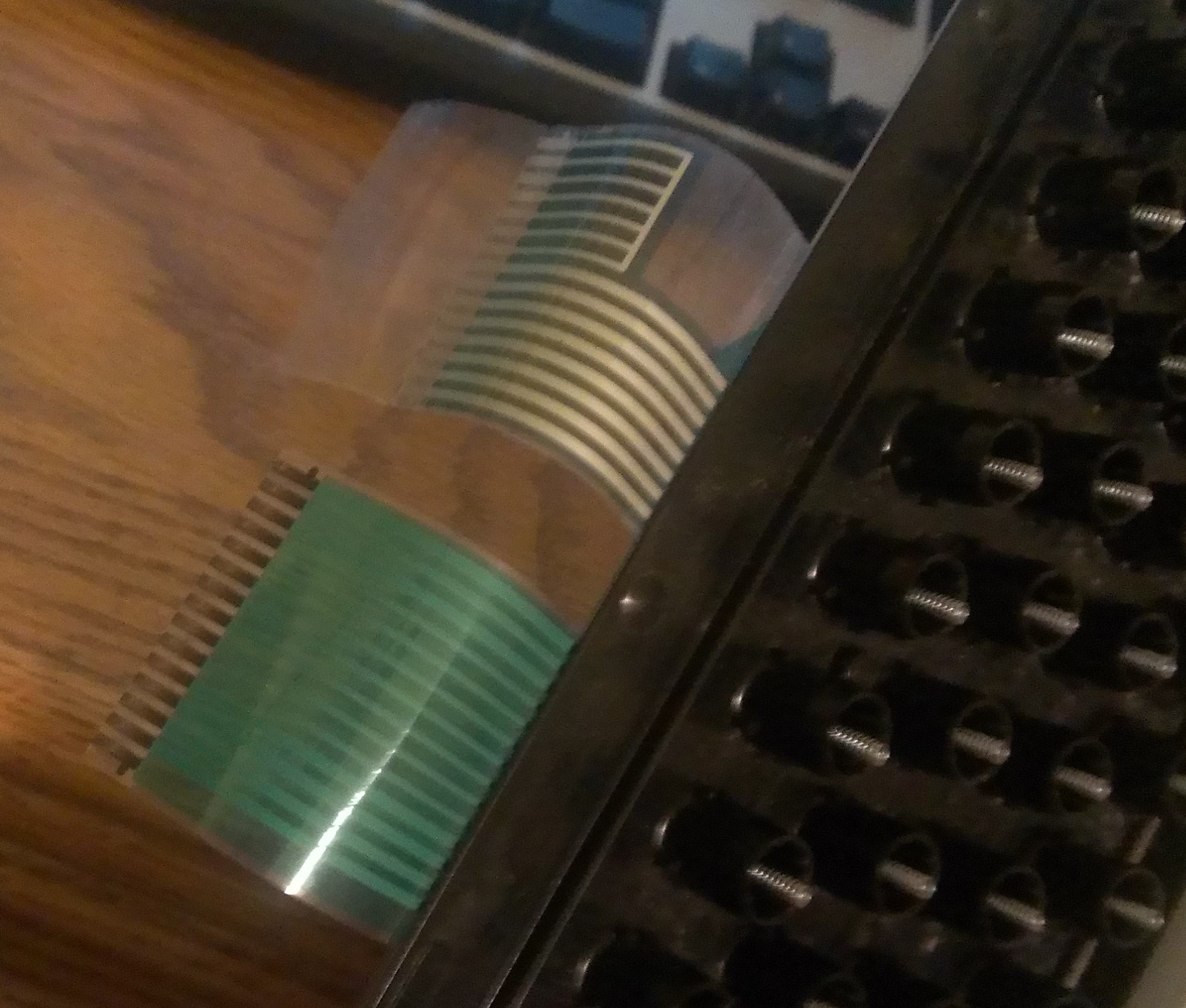 The ribbon coming out of the back of the board