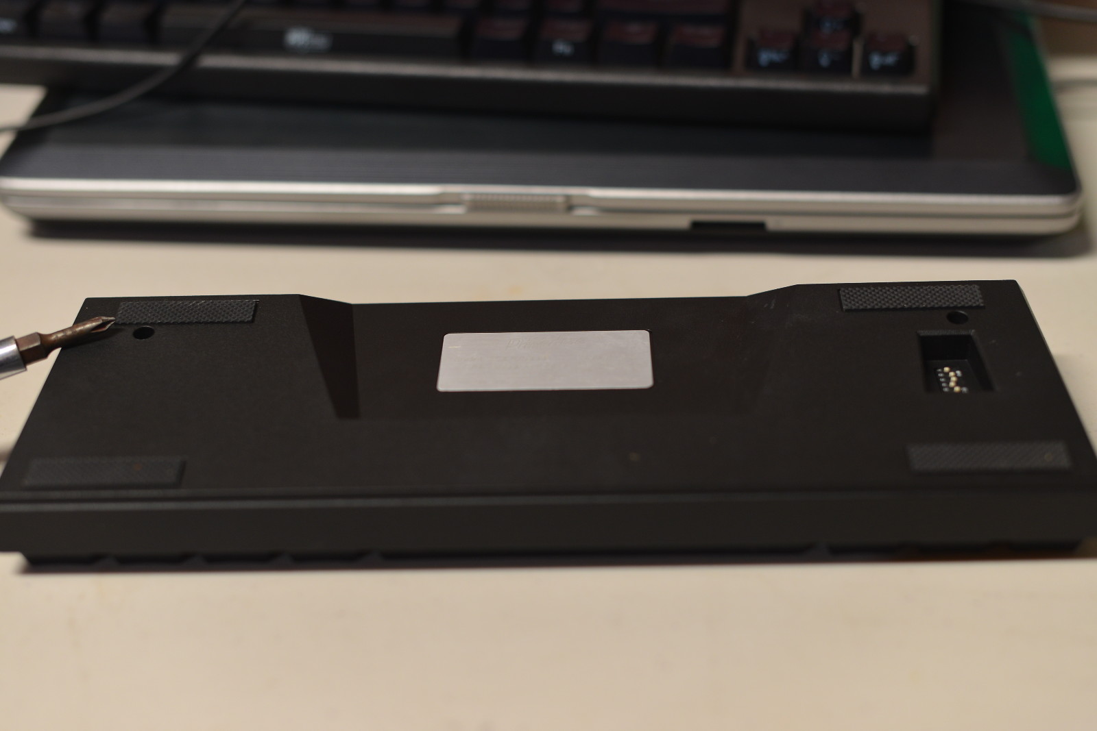 Opening the V60. These two screws come out first.