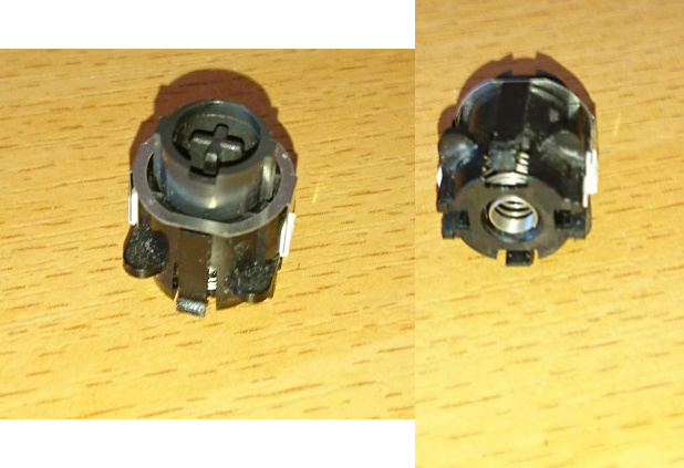 Close-ups of the detached switch, Those white things appears to be click leaves and it seems to be using the spring as part of the contact mechanism. Interesting.