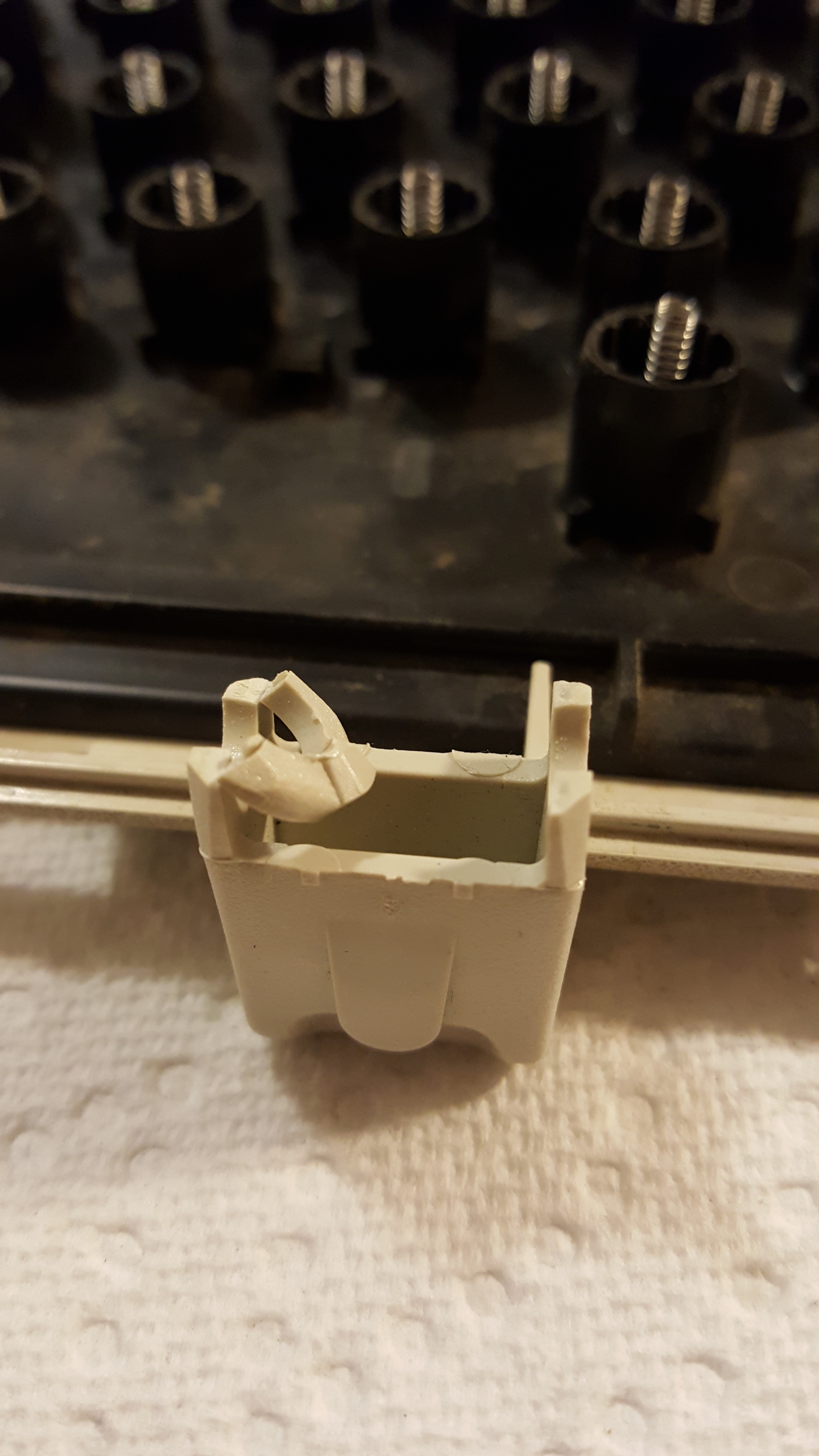 Time for the super glue! This one was tough, because those stems with circular cut-outs actually need to have some flex, as they have two different positions when the foot is in the 'up' or 'down' position. It's not perfect, but I got it back together - one must be delicate when operating the foot though!