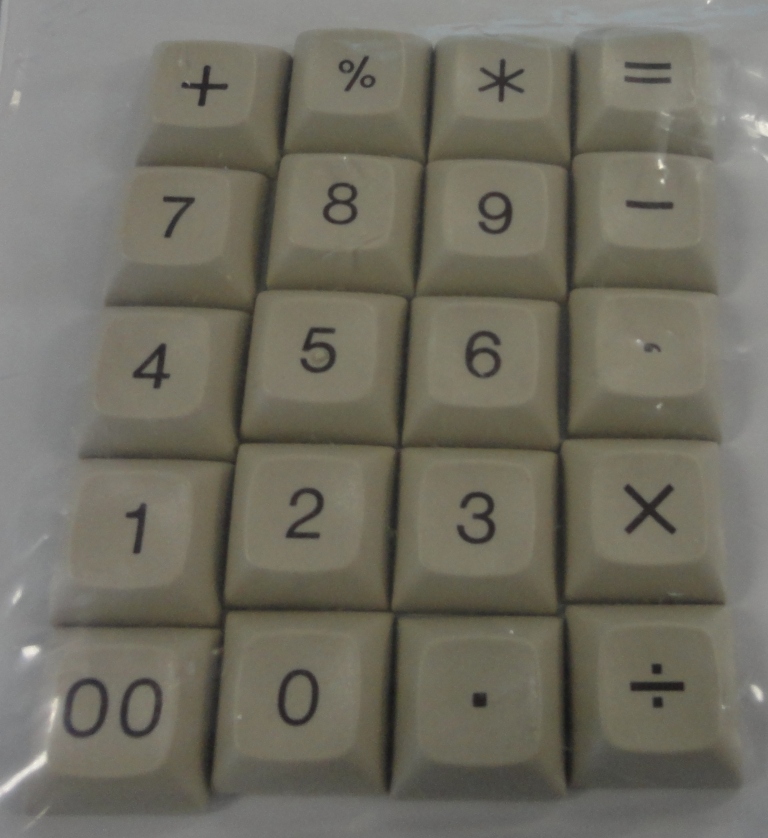 A set of old domed caps - num-block only, 20 keycaps.