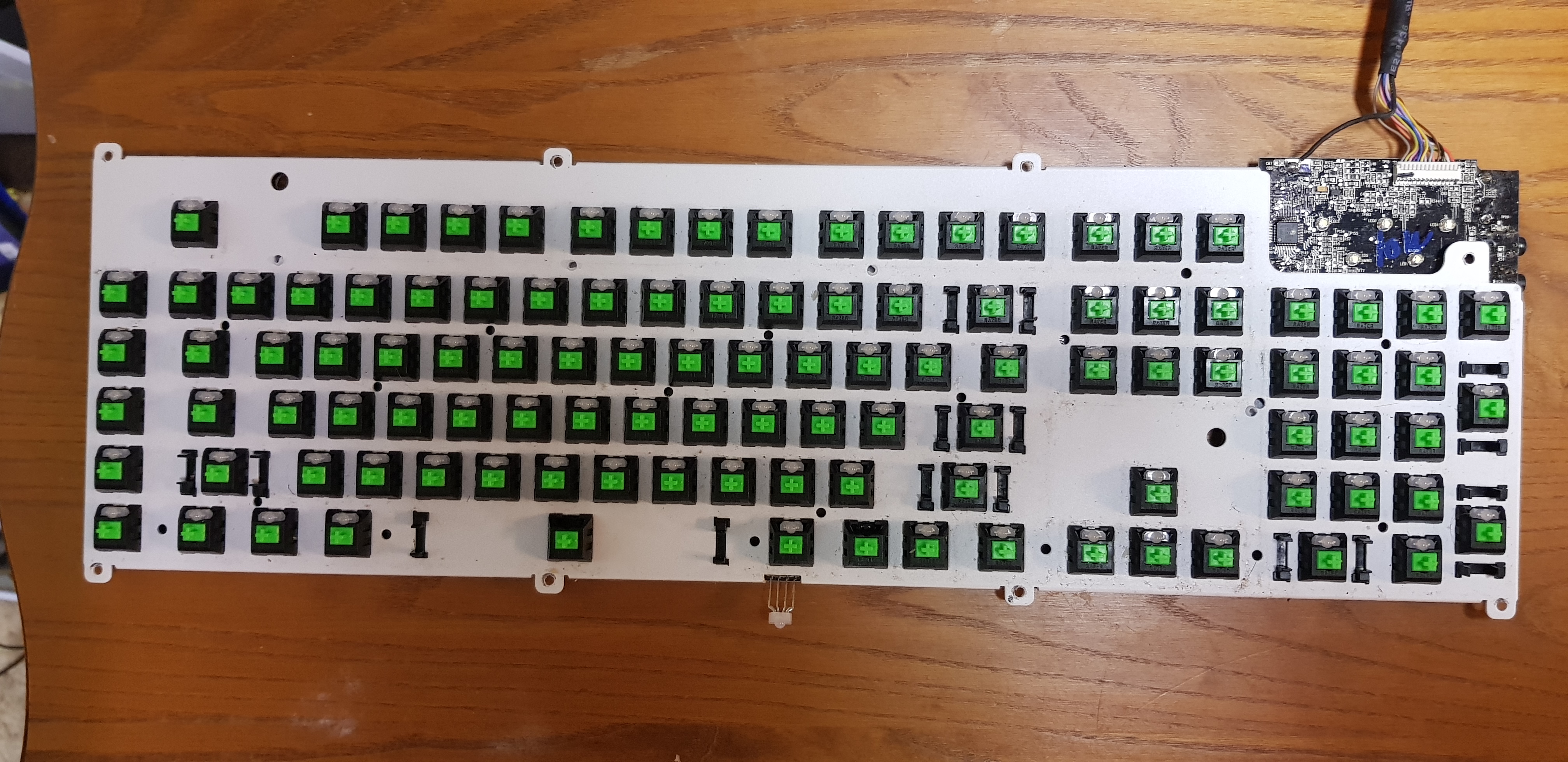 picture of the top of the keyboard PCB with the white aluminium shield