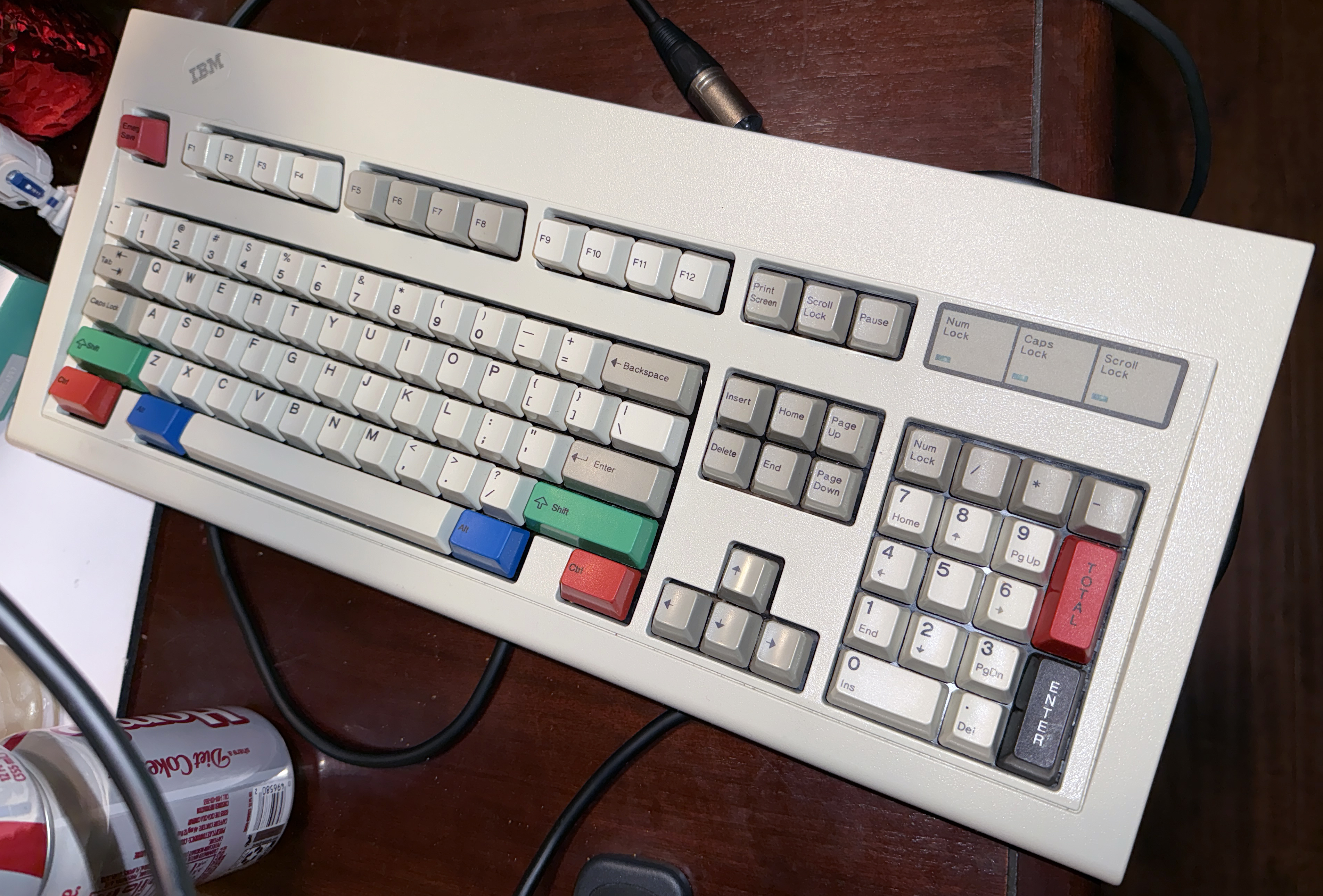 I found this May 4, 1987, model M in its original box, plastic, styrofoam, and accessories (like a heavy black, uncoiled, AC power cord). It has a shiny iridescent steel backplate, and is the second-heaviest model M in my collection. I added Unicomp and other aftermarket keycaps to spruce it up. Replaced the original F and J keys with the same from a model F keyboard so I don't have to hit the homing bumps when I'm typing.<br /><br />.